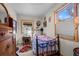 Quaint bedroom filled with vintage furniture, including a metal bed frame and side table at 829 Colorado Blvd, Idaho Springs, CO 80452