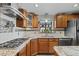 Cozy kitchen featuring granite counters, a gas range, and stainless steel appliances at 829 Colorado Blvd, Idaho Springs, CO 80452