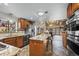 Modern kitchen boasts stainless steel appliances, granite countertops, and a breakfast bar with seating at 829 Colorado Blvd, Idaho Springs, CO 80452
