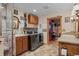 Dual laundry room with modern washer and dryer, dual sinks, cabinetry, and shower at 829 Colorado Blvd, Idaho Springs, CO 80452
