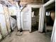 Unfinished basement reveals exposed pipes, a shower stall and an additional room at 2710 Stuart St, Denver, CO 80212