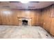 Spacious basement features wood-paneled walls, a brick fireplace, and ample room at 2710 Stuart St, Denver, CO 80212