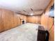 Basement with paneled walls and a brick fireplace, waiting for your personal touch at 2710 Stuart St, Denver, CO 80212