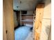 Unfinished basement with built in shelving and basic concrete flooring awaiting updates at 2710 Stuart St, Denver, CO 80212