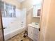 Modest bathroom featuring a tub/shower combo and a single-sink vanity at 2710 Stuart St, Denver, CO 80212