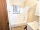 Modest bathroom featuring a tub/shower combo and a single-sink vanity at 2710 Stuart St, Denver, CO 80212