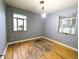 Bedroom with hardwood floors, natural light, and neutral-colored walls at 2710 Stuart St, Denver, CO 80212