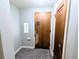 Entryway featuring decorative glass block, tiled floors, and classic wooden door at 2710 Stuart St, Denver, CO 80212