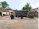 Detached garage with driveway, room for parking, and covered entrance from backyard at 2710 Stuart St, Denver, CO 80212