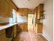 Retro kitchen featuring wooden cabinets and tile backsplash at 2710 Stuart St, Denver, CO 80212