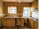 Kitchen with retro cabinets and dual sinks, in need of renovation at 2710 Stuart St, Denver, CO 80212