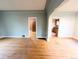 Bright living room with hardwood floors and open access to the kitchen and other rooms at 2710 Stuart St, Denver, CO 80212