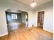 Living room with hardwood floors and open access to the kitchen and other rooms at 2710 Stuart St, Denver, CO 80212