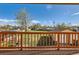 Beautiful view from the home's balcony overlooking the large backyard and neighboring properties at 5420 E 61St Way, Commerce City, CO 80022