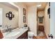 Well-lit bathroom featuring granite countertops, modern fixtures, and neutral walls at 5420 E 61St Way, Commerce City, CO 80022