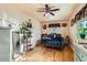 Cozy bedroom with hardwood floors, ceiling fan, decor, and a comfortable bed at 5420 E 61St Way, Commerce City, CO 80022