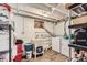 Functional laundry room with a utility sink, washer, dryer, and additional storage shelves at 5420 E 61St Way, Commerce City, CO 80022
