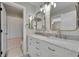 Modern bathroom with double vanity and marble countertop at 7706 S Duquesne Way, Aurora, CO 80016