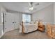 Serene bedroom with classic wooden furniture and window seat at 7706 S Duquesne Way, Aurora, CO 80016