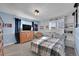 Bright bedroom with built-in shelving and a cozy sitting area at 7706 S Duquesne Way, Aurora, CO 80016