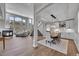 Open concept dining room and living room with hardwood floors at 7706 S Duquesne Way, Aurora, CO 80016