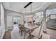 Elegant dining room with hardwood floors and modern chandelier at 7706 S Duquesne Way, Aurora, CO 80016