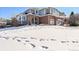 Two-story home with brick and siding exterior at 7706 S Duquesne Way, Aurora, CO 80016