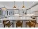 Large kitchen island with seating and expansive countertop space at 7706 S Duquesne Way, Aurora, CO 80016