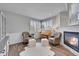 Cozy living room with fireplace and comfortable seating at 7706 S Duquesne Way, Aurora, CO 80016