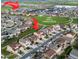 Community aerial view showcasing K-8 School, park, pool, and fitness center at 19894 W 94Th Ln, Arvada, CO 80007