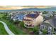 Beautiful home with a covered porch and mountain views shows off the neighborhood's serene setting at 19894 W 94Th Ln, Arvada, CO 80007