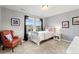 Cozy bedroom with a white sleigh bed, a window with neighborhood views, and calming gray wall paint at 19894 W 94Th Ln, Arvada, CO 80007