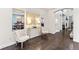 Bright, inviting foyer with hardwood floors and stylish decor creates a lasting first impression at 19894 W 94Th Ln, Arvada, CO 80007