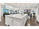 Bright, open kitchen features a large island, stainless steel appliances, and backyard views at 19894 W 94Th Ln, Arvada, CO 80007