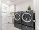 Convenient laundry room equipped with modern washer and dryer units at 19894 W 94Th Ln, Arvada, CO 80007