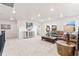 Open living space with ample natural light, a cozy couch, and stylish accent pieces at 19894 W 94Th Ln, Arvada, CO 80007