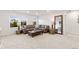 Spacious living area featuring a comfortable couch, large windows, and elegant decor at 19894 W 94Th Ln, Arvada, CO 80007