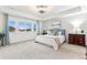Serene bedroom with tray ceilings, ample windows, and tasteful furniture at 19894 W 94Th Ln, Arvada, CO 80007