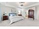 Inviting main bedroom boasts a tray ceiling, soft colors, and beautiful window views at 19894 W 94Th Ln, Arvada, CO 80007