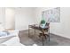 Bright office with hardwood floors, desk, and comfortable seating with lots of natural light at 19894 W 94Th Ln, Arvada, CO 80007