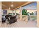 Inviting covered porch with stylish seating, perfect for enjoying peaceful evenings and outdoor relaxation at 19894 W 94Th Ln, Arvada, CO 80007