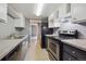 Functional kitchen with stainless steel appliances and ample counter space at 9995 E Harvard Ave # 166, Denver, CO 80231