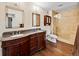 Primary bathroom featuring dual sinks, granite countertops, and a glass enclosed shower at 2121 Enterprise St, Superior, CO 80027