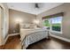 Cozy bedroom with neutral walls, wood floors, and a large window offering scenic views for a peaceful retreat at 2121 Enterprise St, Superior, CO 80027