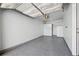 Spacious garage with ample storage, featuring a newly coated epoxy floor at 2121 Enterprise St, Superior, CO 80027