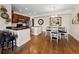 Modern kitchen with granite countertops, stainless steel appliances, and a dining area, ideal for entertaining at 2121 Enterprise St, Superior, CO 80027