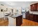 Open-concept living area showcasing a kitchen with granite countertops, stainless appliances, and light filled rooms at 2121 Enterprise St, Superior, CO 80027