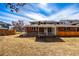 A view of the house from the backyard shows a covered patio with a white fence at 3611 W 79Th Ave # B4, Westminster, CO 80030