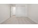 Empty bedroom with gray carpet, white trim, and a closet at 3611 W 79Th Ave # B4, Westminster, CO 80030