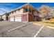 View of multi-unit residential building exterior and parking spaces at 3611 W 79Th Ave # B4, Westminster, CO 80030